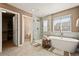 Modern bathroom featuring standalone tub and walk-in glass shower at 5128 Longs Peak St, Brighton, CO 80601