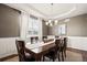 Elegant dining room with tray ceiling and stylish light fixture at 5128 Longs Peak St, Brighton, CO 80601