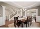Bright dining room with hardwood floors and views of the staircase at 5128 Longs Peak St, Brighton, CO 80601