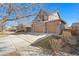 Lovely two-story house with a driveway and attached two-car garage at 5128 Longs Peak St, Brighton, CO 80601