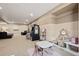 Bright game room featuring an arcade machine, seating, and play area, perfect for entertainment at 5128 Longs Peak St, Brighton, CO 80601
