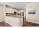 Well-lit kitchen with ample counter space and stainless steel appliances at 5128 Longs Peak St, Brighton, CO 80601