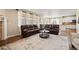 Comfortable living room with hardwood floors and an open layout at 5128 Longs Peak St, Brighton, CO 80601