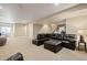 Spacious living room with a plush leather sectional, open layout, and inviting atmosphere at 5128 Longs Peak St, Brighton, CO 80601