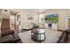 Inviting living room features hardwood floors, comfortable seating, and a modern entertainment center at 5128 Longs Peak St, Brighton, CO 80601