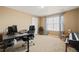 Functional home office space with ample natural light, a desk setup, and space for a piano at 5128 Longs Peak St, Brighton, CO 80601