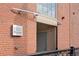 Exterior view of the building entrance with brick and sign at 1301 Wazee St # 3C, Denver, CO 80204
