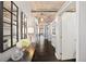 Inviting hallway features modern decor, views to the living areas, and hardwood floors at 1301 Wazee St # 3C, Denver, CO 80204