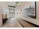 Lobby with tile floor, soft lighting, seating and artwork on the walls at 1301 Wazee St # 3C, Denver, CO 80204