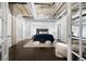 Bright main bedroom boasts exposed ductwork, modern lighting, and neutral decor at 1301 Wazee St # 3C, Denver, CO 80204