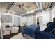 Comfortable main bedroom offers exposed ductwork, and a view to the bathroom at 1301 Wazee St # 3C, Denver, CO 80204