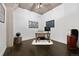 Office with modern decor, dark hardwood floors, and exposed ductwork at 1301 Wazee St # 3C, Denver, CO 80204