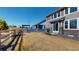 Spacious backyard with a well maintained lawn and partial wood fence, perfect for outdoor gatherings at 3062 Grizzly Peak Dr, Broomfield, CO 80023
