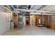 Unfinished basement with exposed ceiling, concrete floor and mechanical equipment at 3062 Grizzly Peak Dr, Broomfield, CO 80023