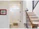Bathroom with a tiled shower-tub combo and a toilet next to the staircase at 3062 Grizzly Peak Dr, Broomfield, CO 80023