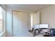 Bright bedroom featuring a closet, an open door, and a desk with computer monitors for a comfortable workspace at 3062 Grizzly Peak Dr, Broomfield, CO 80023