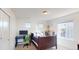 Bedroom featuring a large window, a bed, a desk, and lots of natural light at 3062 Grizzly Peak Dr, Broomfield, CO 80023
