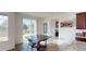 Cozy dining area with sliding glass door, wood floors, and natural light at 3062 Grizzly Peak Dr, Broomfield, CO 80023