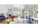 Bright living room with fireplace, large windows, and open floor plan at 3062 Grizzly Peak Dr, Broomfield, CO 80023