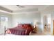 Spacious main bedroom featuring a tray ceiling with an attached bathroom at 3062 Grizzly Peak Dr, Broomfield, CO 80023