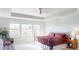 Bright main bedroom featuring large windows offering scenic views and comfortable furnishings at 3062 Grizzly Peak Dr, Broomfield, CO 80023