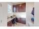 Dedicated workspace area with built-in cabinets and granite countertops at 3062 Grizzly Peak Dr, Broomfield, CO 80023