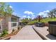 Spacious backyard with patio, outdoor dining set, and hot tub, perfect for outdoor enjoyment at 6405 Eagle Feather Trl, Littleton, CO 80125