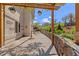 Beautiful stone-lined backyard patio with outdoor seating and landscaping at 6405 Eagle Feather Trl, Littleton, CO 80125