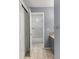 Bathroom featuring a walk-in shower, gray walls, and tile flooring, enhanced by natural light and functionality at 6405 Eagle Feather Trl, Littleton, CO 80125