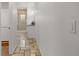 Bathroom showcasing tile flooring leading to a shower and vanity with granite counter tops at 6405 Eagle Feather Trl, Littleton, CO 80125