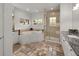 A luxurious bathroom featuring a soaking tub, glass shower, and granite countertops at 6405 Eagle Feather Trl, Littleton, CO 80125