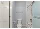 Bright bathroom features a shower over bath with white fixtures, and a functional layout at 6405 Eagle Feather Trl, Littleton, CO 80125