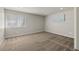 Spacious bedroom featuring neutral carpet, a window, and neutral wall paint at 6405 Eagle Feather Trl, Littleton, CO 80125