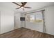 This bedroom features an inviting space with beautiful wood floors and a ceiling fan at 6405 Eagle Feather Trl, Littleton, CO 80125