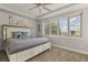 Bedroom featuring a large window, neutral color scheme, and a large bed at 6405 Eagle Feather Trl, Littleton, CO 80125