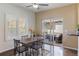 Cozy breakfast nook with a wooden table set and sliding glass doors leading to the outdoor patio at 6405 Eagle Feather Trl, Littleton, CO 80125