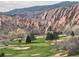 Picturesque golf course with beautiful red rocks in the background creating a great view at 6405 Eagle Feather Trl, Littleton, CO 80125