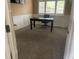 Bright office with white wainscoting, neutral paint, and a large window showcasing outdoor views at 6405 Eagle Feather Trl, Littleton, CO 80125