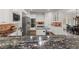A gourmet kitchen featuring stainless steel appliances, granite counters and an island gas cooktop at 6405 Eagle Feather Trl, Littleton, CO 80125