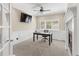 This is a nicely appointed home office with a window, a fireplace and wainscoting, offering a great workspace at 6405 Eagle Feather Trl, Littleton, CO 80125