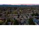 Panoramic aerial view showcasing a suburban neighborhood with mountain views at sunset at 1225 Baker St, Longmont, CO 80501