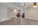 Large open basement area with finished concrete floor, recessed lighting and drop ceiling at 1225 Baker St, Longmont, CO 80501