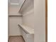 Walk-in closet featuring shelving and storage with carpeted floor at 1225 Baker St, Longmont, CO 80501