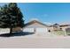 Home exterior features a two-car garage and landscaped front yard at 1225 Baker St, Longmont, CO 80501