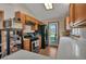 Kitchen features stainless steel appliances and a window with natural light at 1225 Baker St, Longmont, CO 80501