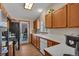 Open concept kitchen with sleek appliances and wood cabinets at 1225 Baker St, Longmont, CO 80501