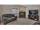 Living room features fireplace, a sofa, and neutral tones at 1225 Baker St, Longmont, CO 80501
