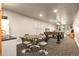 Recreational basement space offers seating and game options at 11881 County Road 37, Fort Lupton, CO 80621