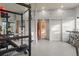 Basement home gym equipped with exercise equipment and custom storage solutions at 11881 County Road 37, Fort Lupton, CO 80621