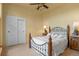 Bedroom features a metal bed frame, neutral carpet, and matching bedside tables with lamps at 11881 County Road 37, Fort Lupton, CO 80621